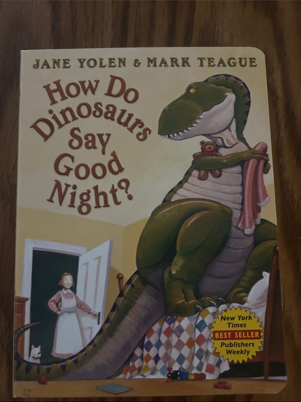 Scholastic Yellow Book Back Cover with Colorful Dinosaur Illustrations
